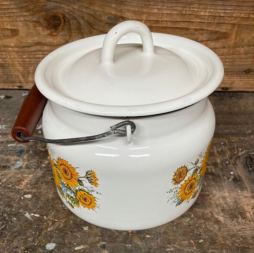 White enamel pot with handle and lid, sunflower décor.