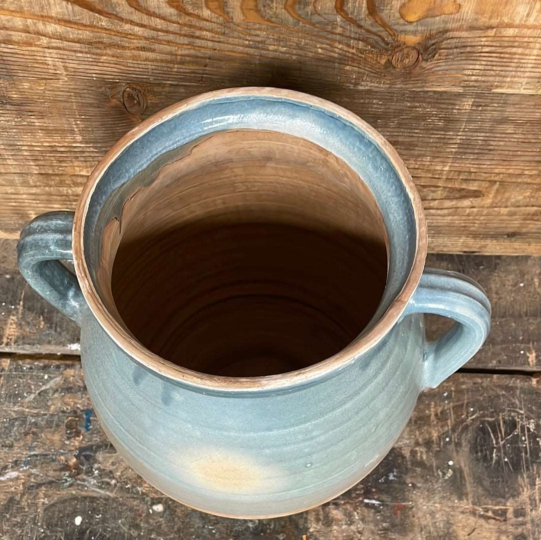 Hungarian hand thrown terracotta part glazed urn pot with two handles.