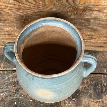 Hungarian hand thrown terracotta part glazed urn pot with two handles.