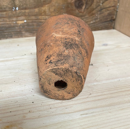 Small vintage terracotta flower pot, bottom view.