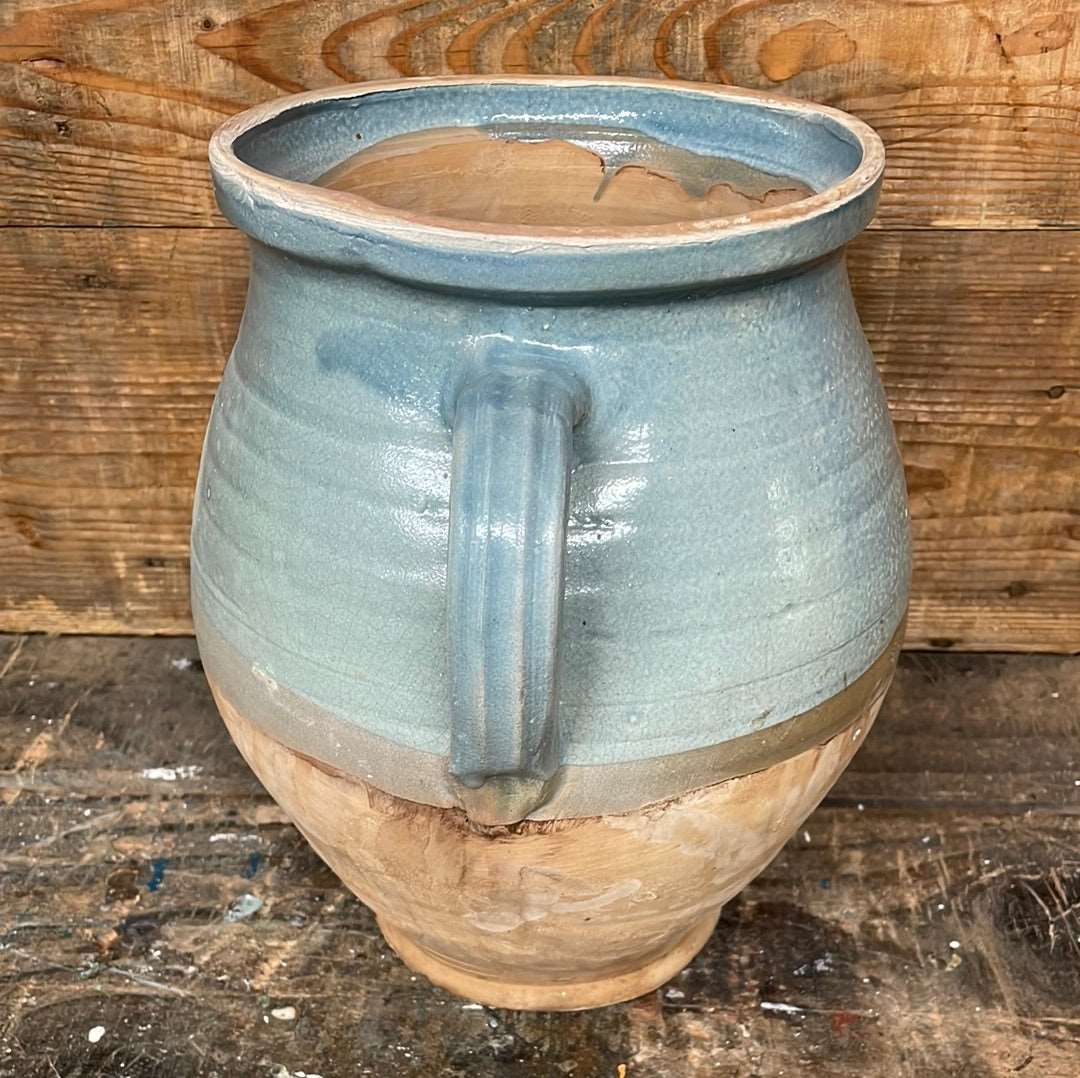Hungarian hand thrown terracotta part glazed urn pot with two handles.