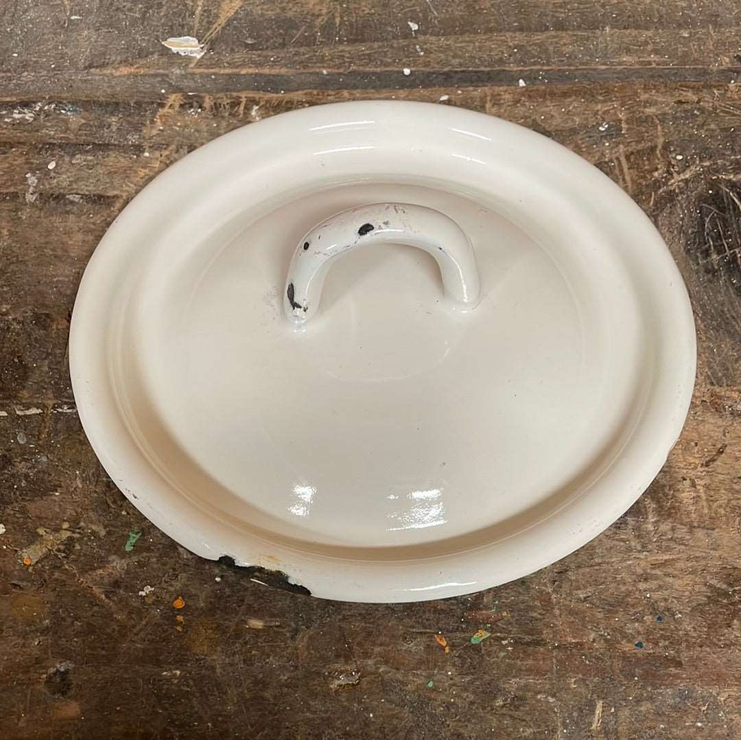 White enamel pot with handle and lid, sunflower décor.