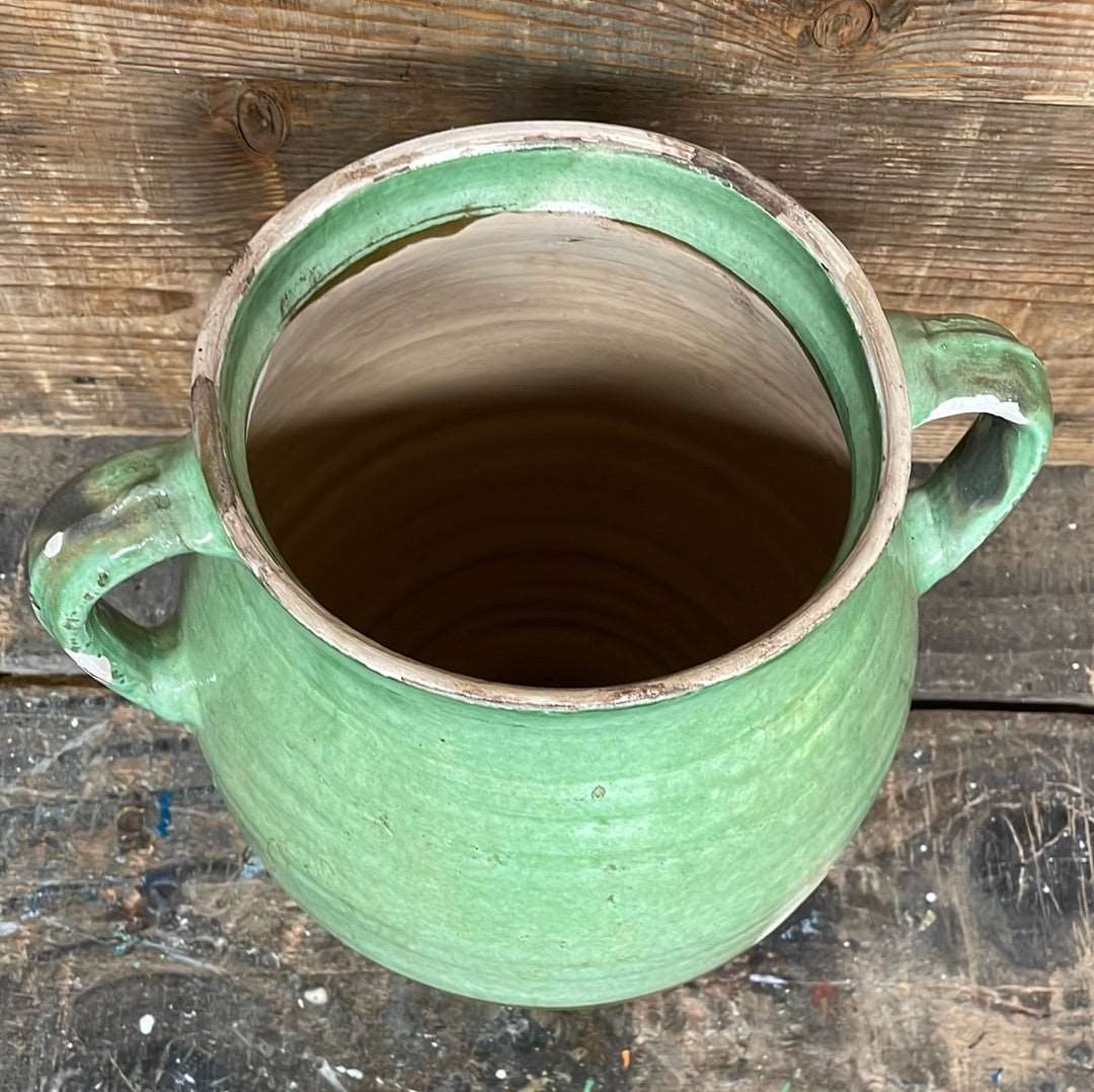 Hungarian hand thrown terracotta part glazed urn pot with two handles.