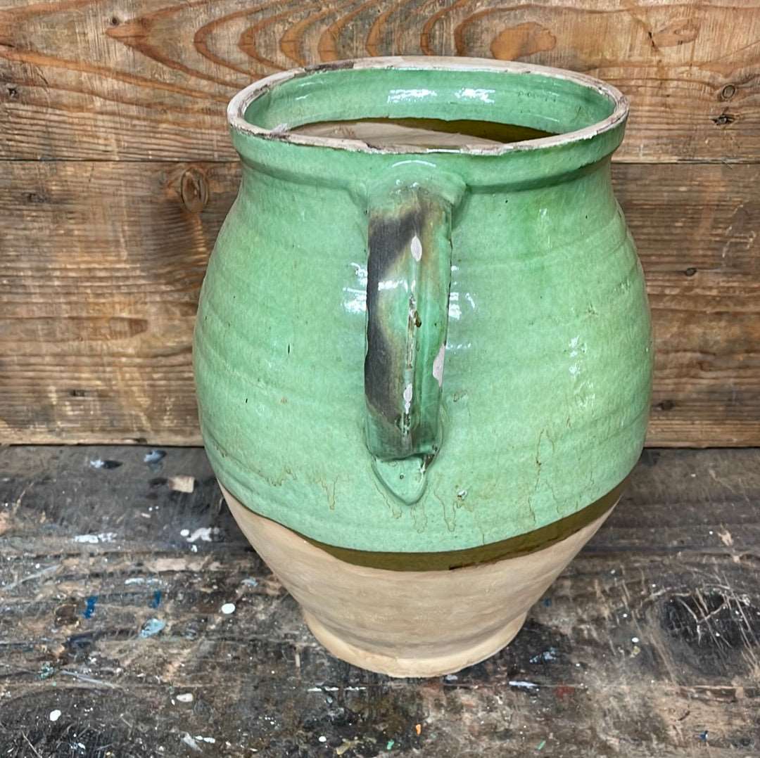 Hungarian hand thrown terracotta part glazed urn pot with two handles.
