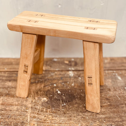 Mini handcrafted 4 legged cherrywood stool.