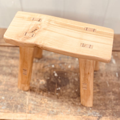 Mini 4 legged cherrywood handcrafted stool.