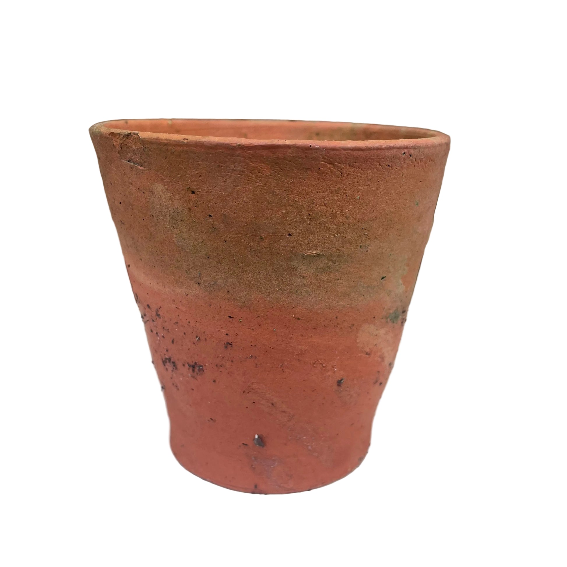 Terracotta pot on a white surface