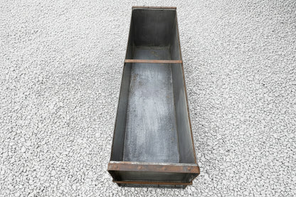 Large metal rectangular trough planter.
