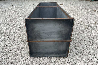 Large metal rectangular trough planter.