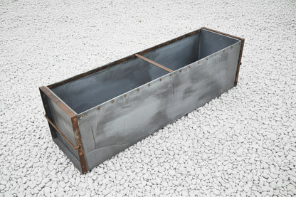 Large metal rectangular trough planter.