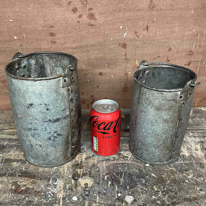 Metal planter bucket with handle.