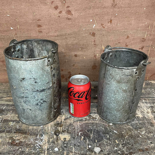 Metal planter bucket with handle.