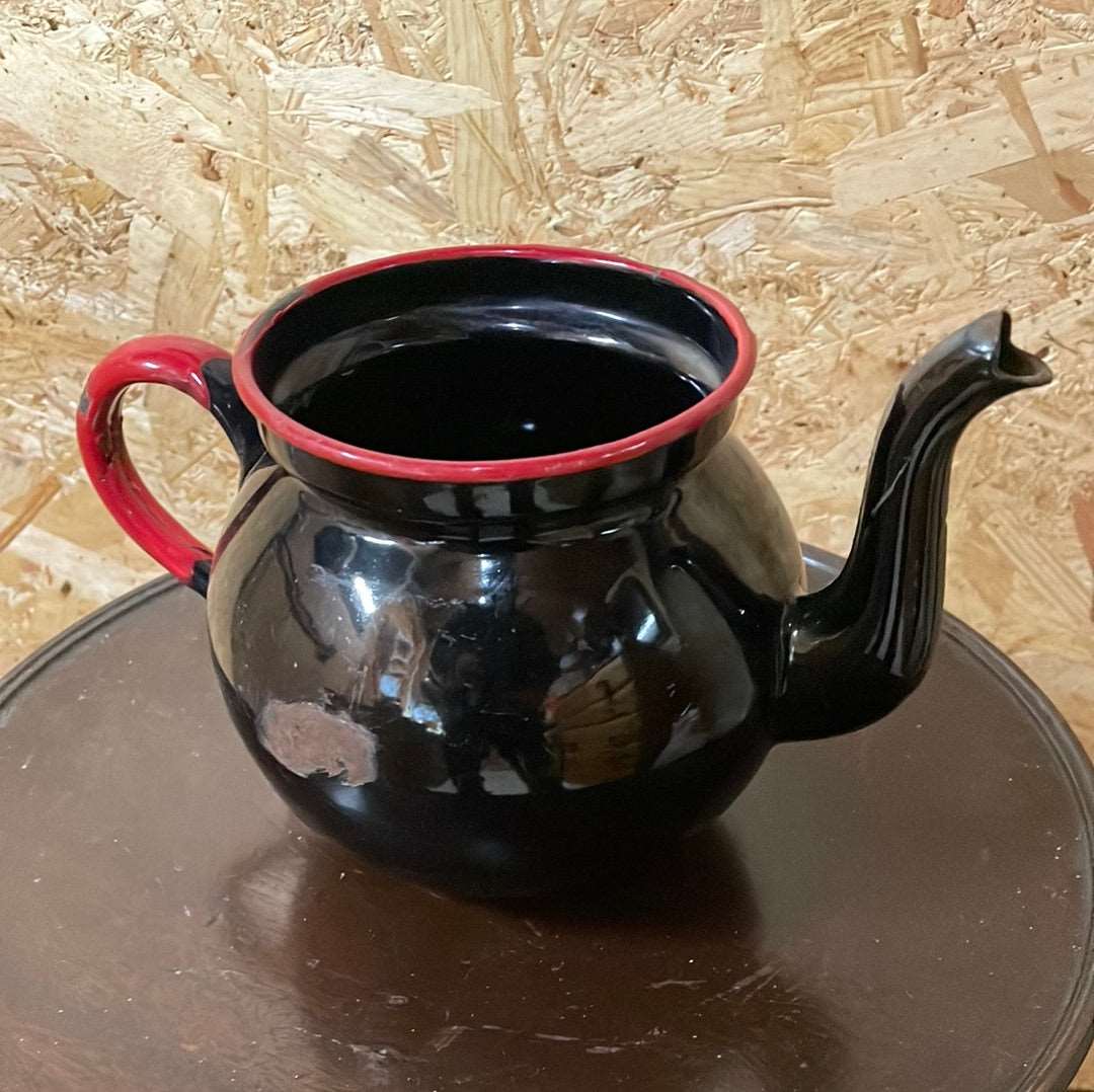 Black enamel tea pot without lid.
