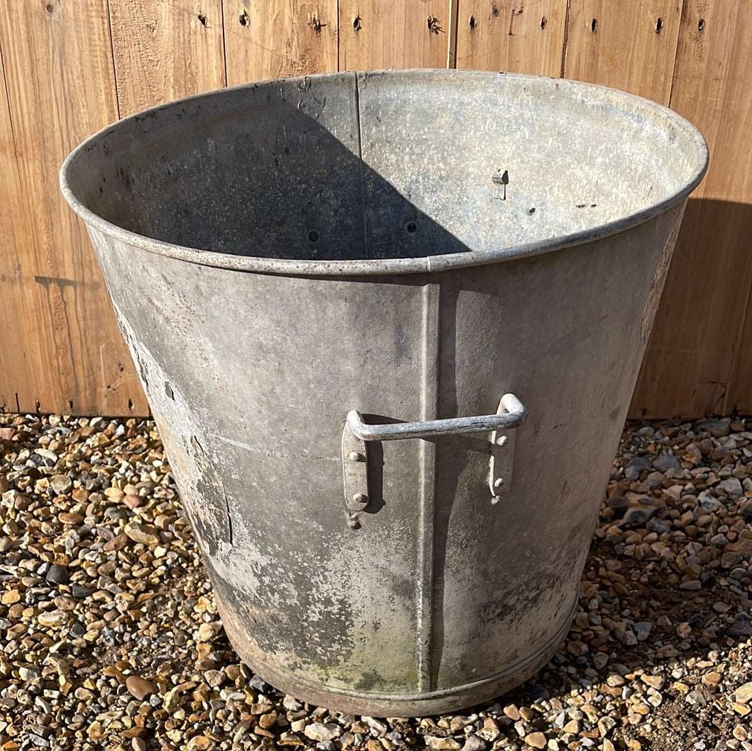 Taper sided two handled rustic galvanised bin planter.