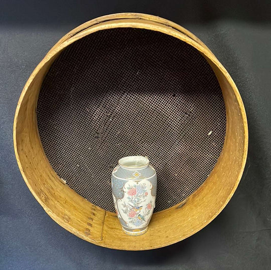 Vintage wooden sided grain sieve.