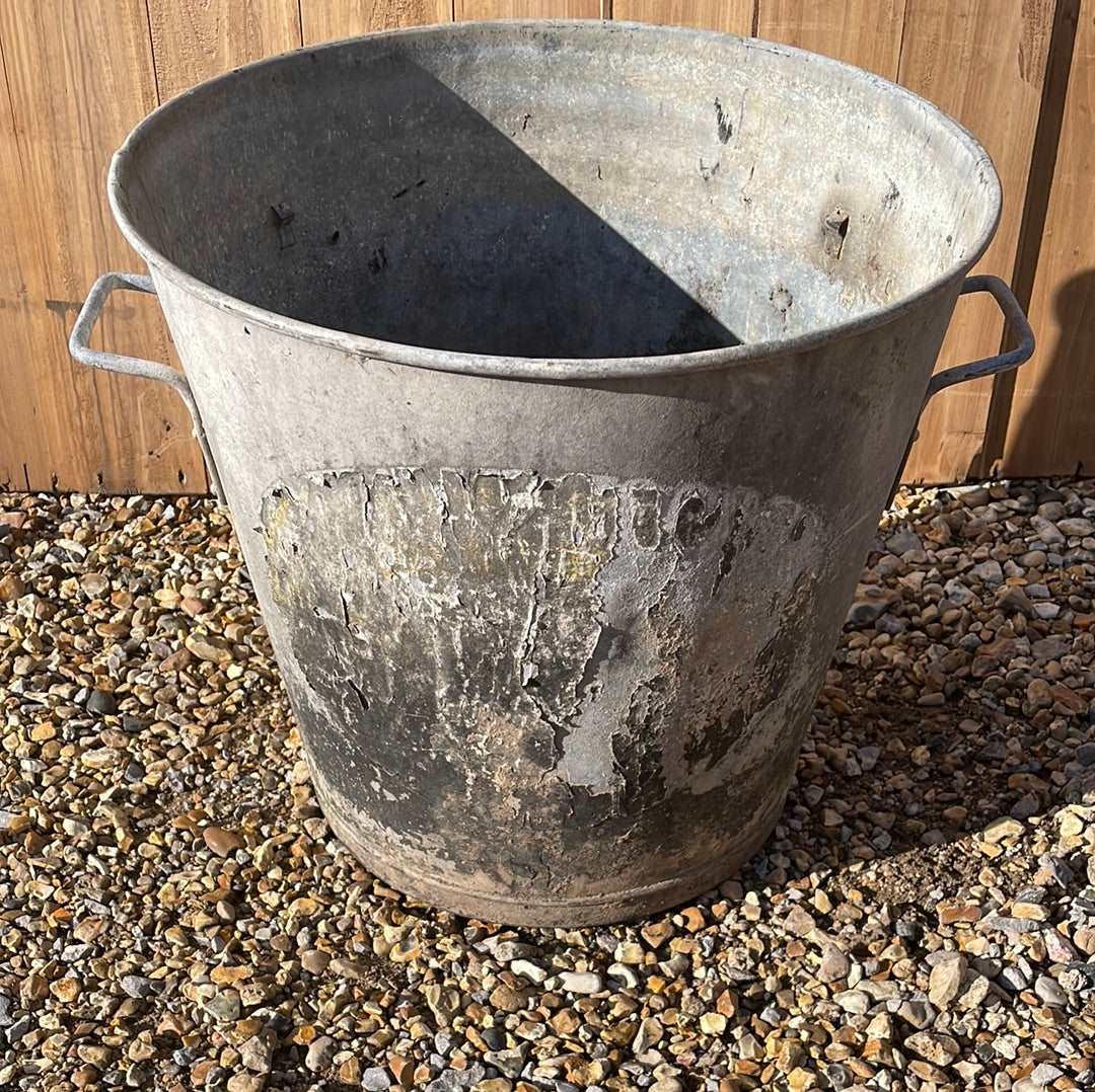 Taper sided two handled rustic galvanised bin planter.