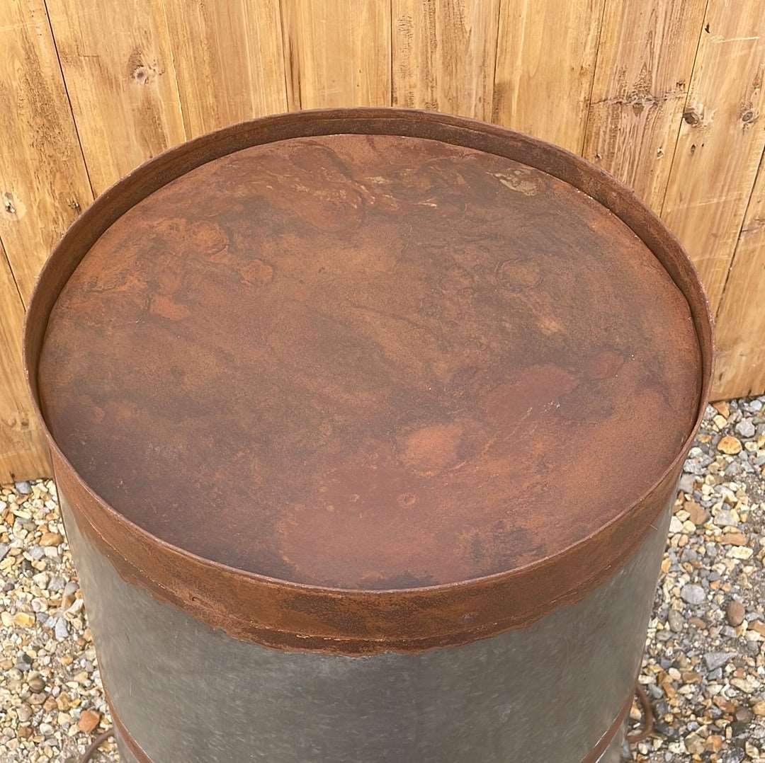 Large bucket type metal planter tree planting pot.