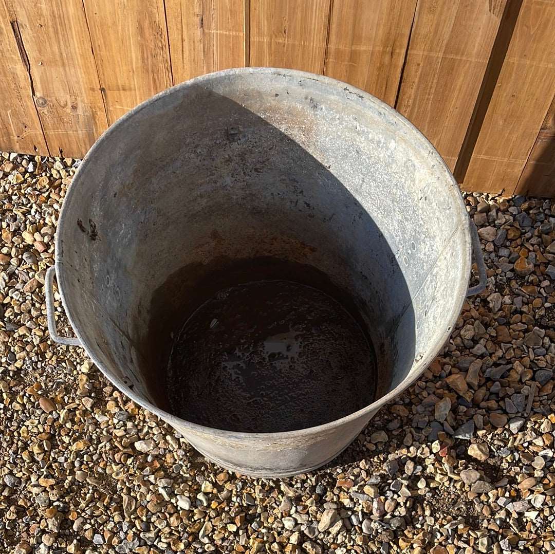Taper sided two handled rustic galvanised bin planter.