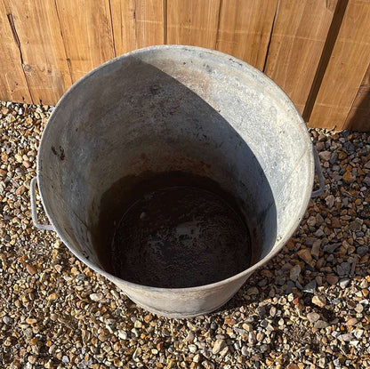 Taper sided two handled rustic galvanised bin planter.