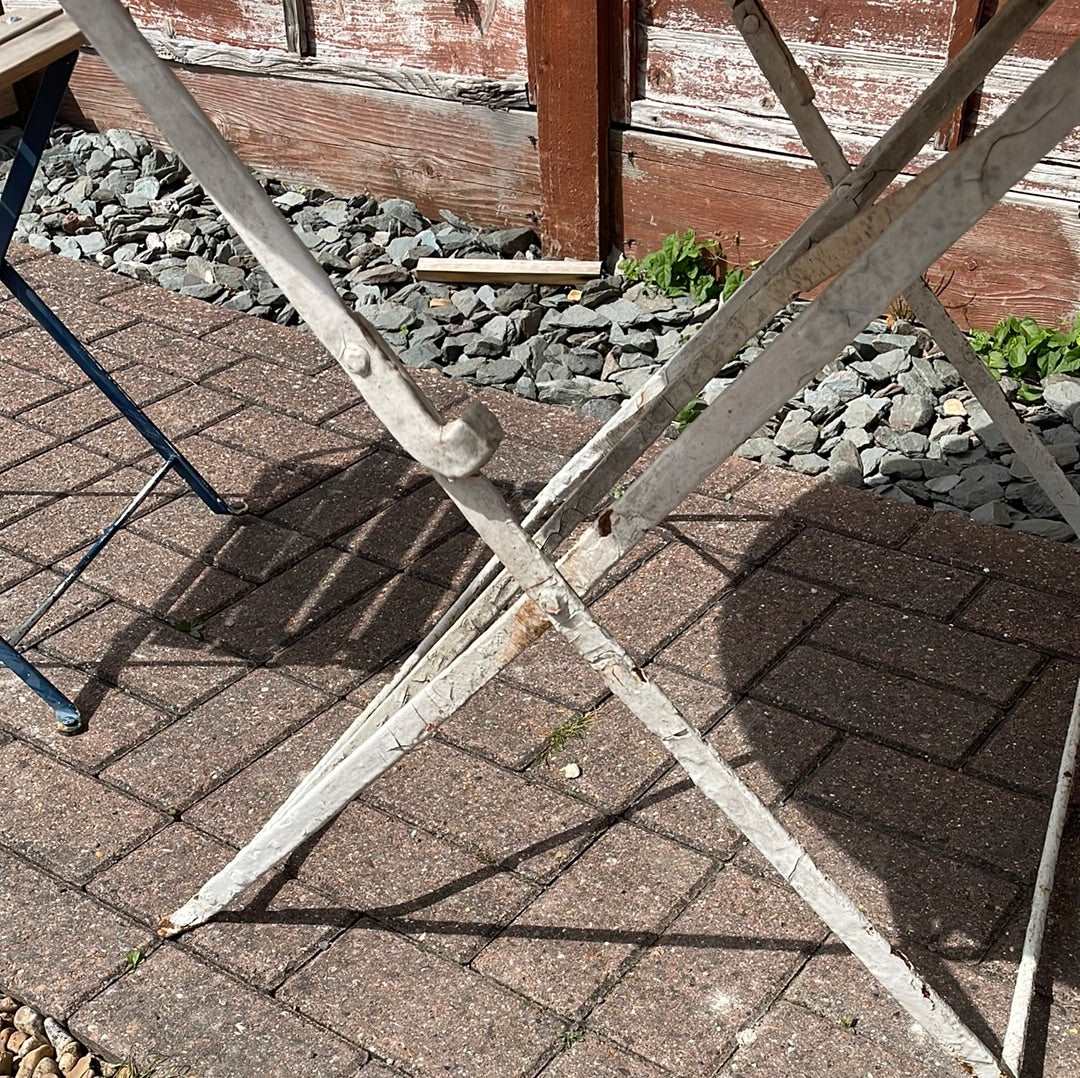 Vintage French round folding bistro table.