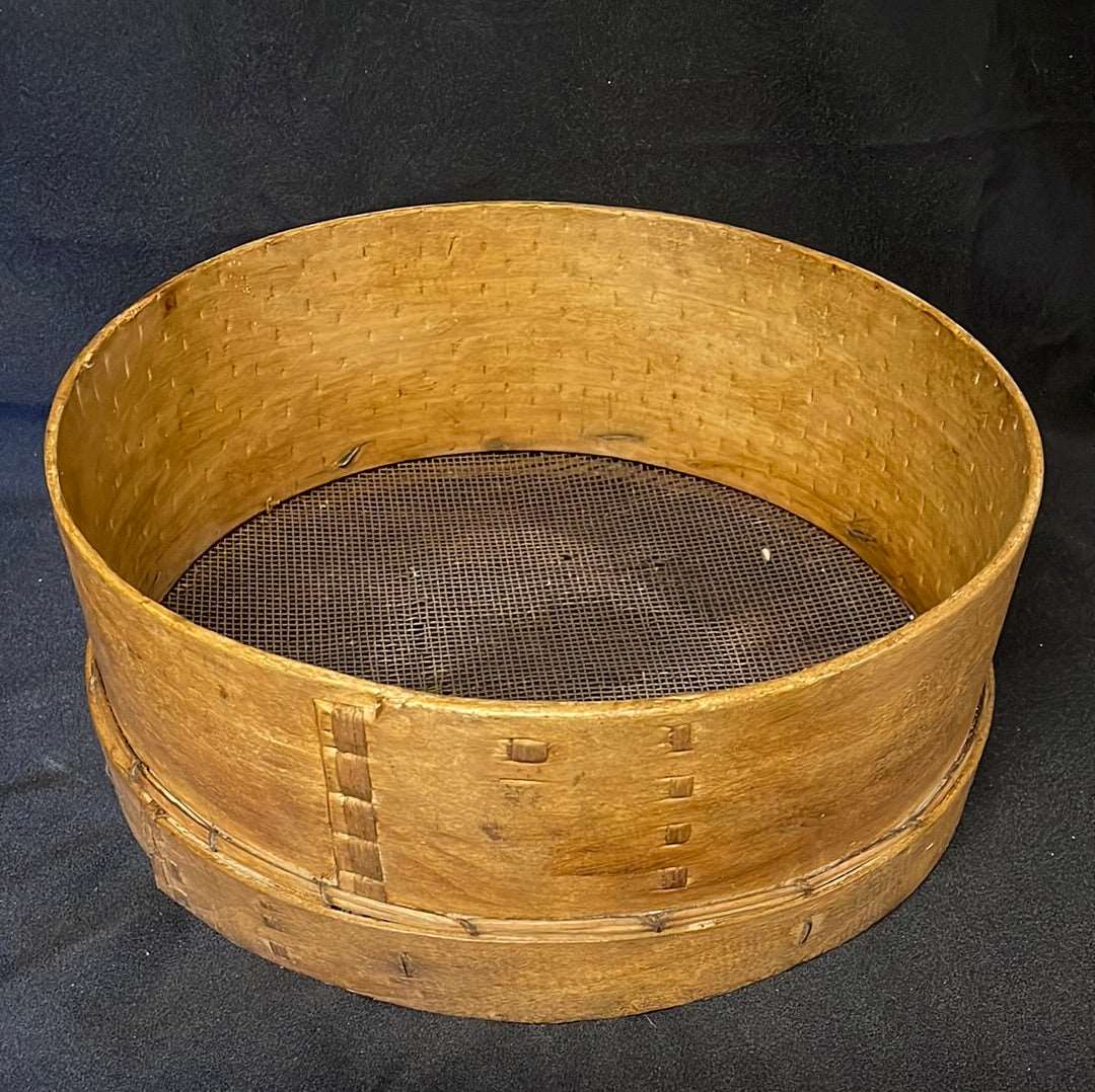 Vintage wooden sided grain sieve.