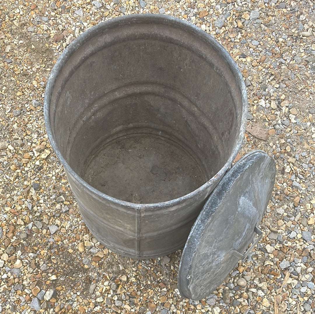 Small galvanised dustbin with lid.