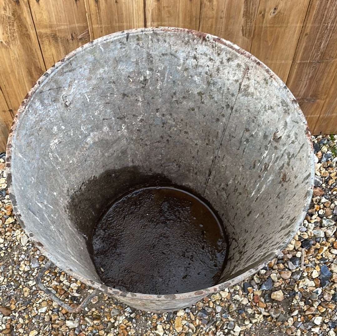 Taper sided two handled rustic galvanised bin garden planter container.