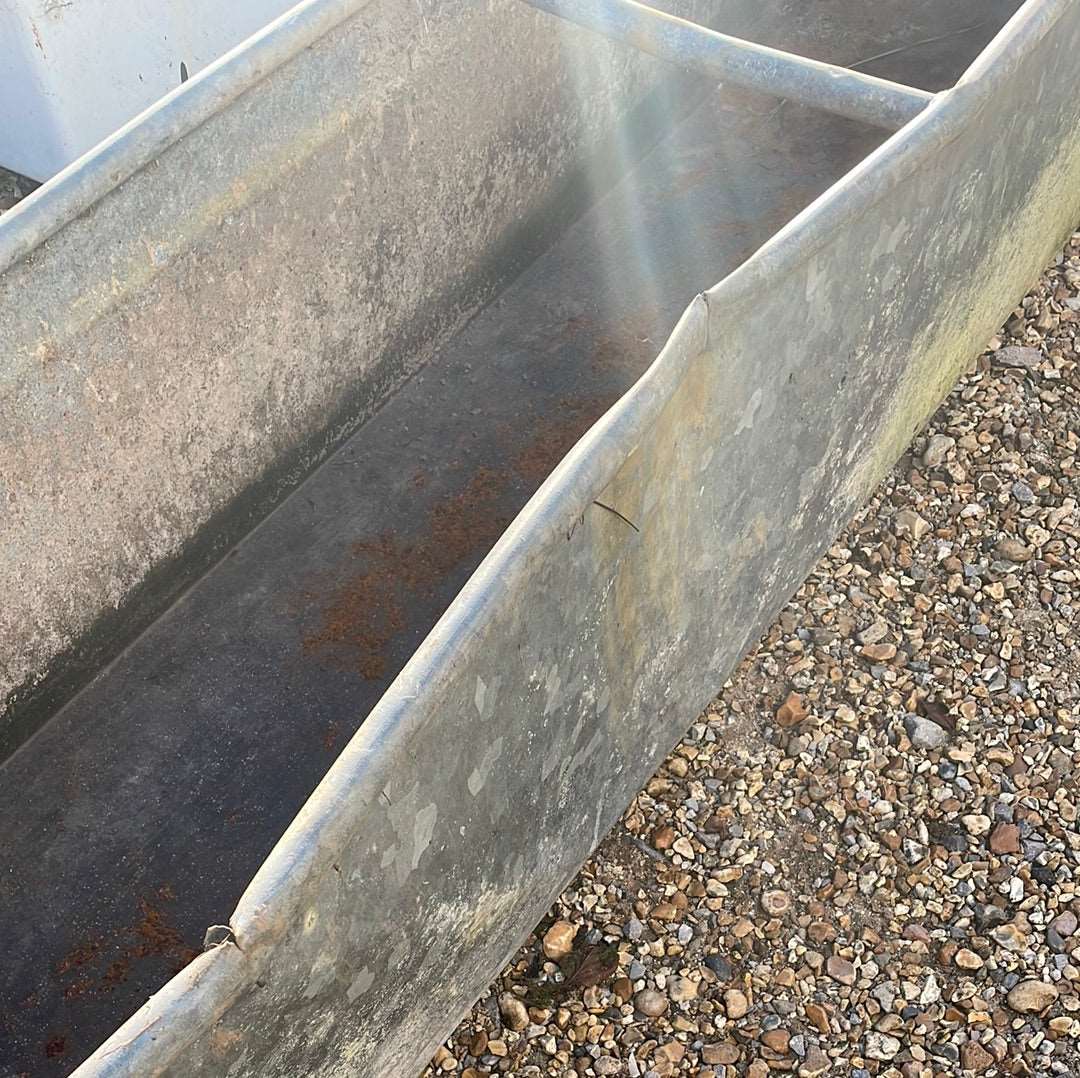 Vintage galvanised rustic water trough planter.