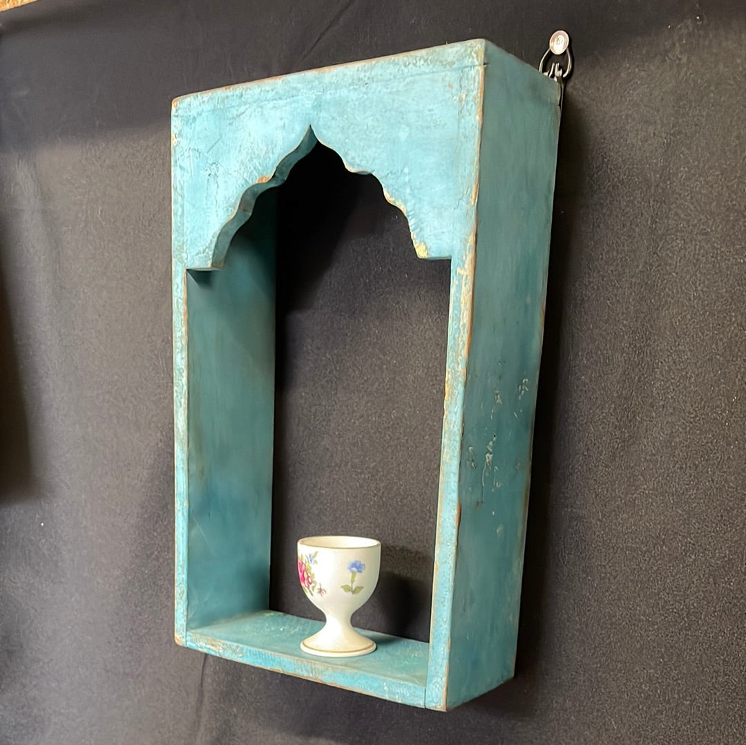 Single Indian blue wooden temple shelf.