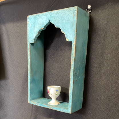 Single Indian blue wooden temple shelf.