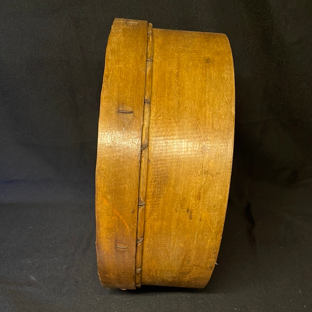 Vintage wooden sided grain sieve.