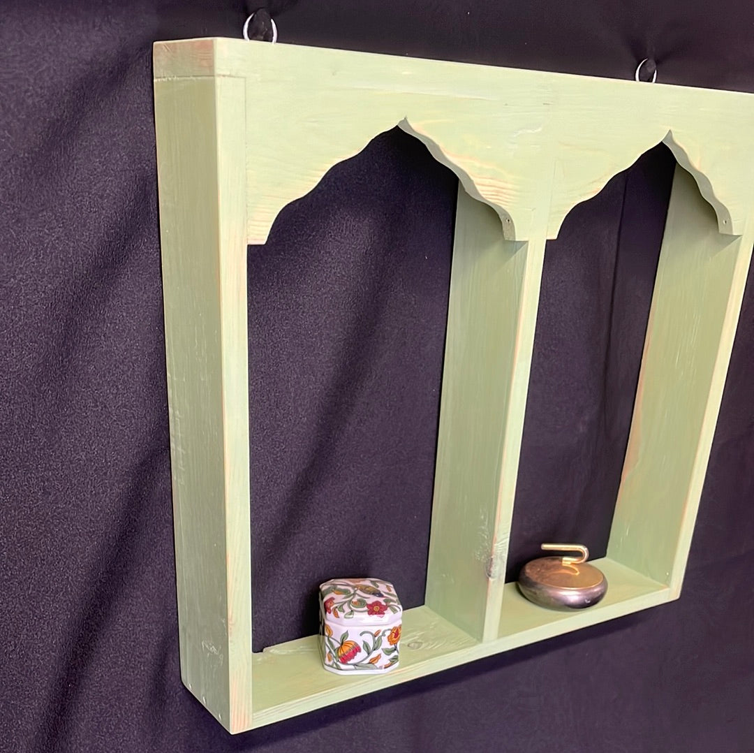 Wooden Indian temple style double sided shelf, light green.