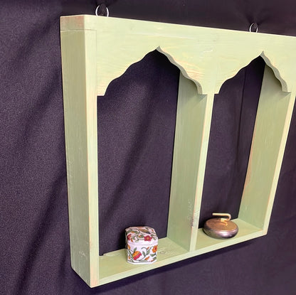 Wooden Indian temple style double sided shelf, light green.