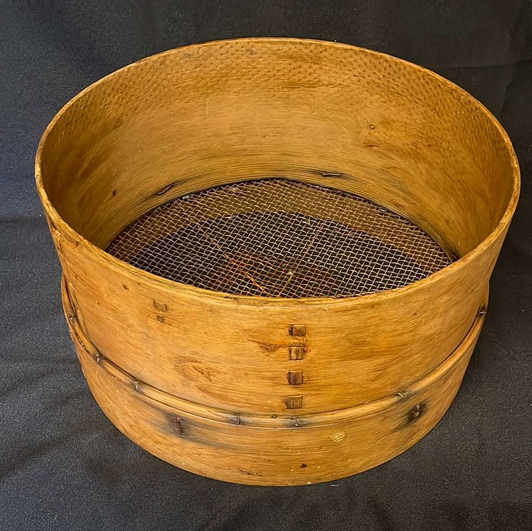 Vintage bent wood grain sieve.