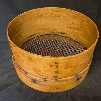 Vintage bent wood grain sieve.